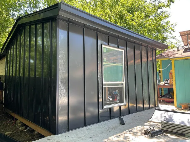 Black standing seam metal wall panels for Roof Inspection in Bartonville