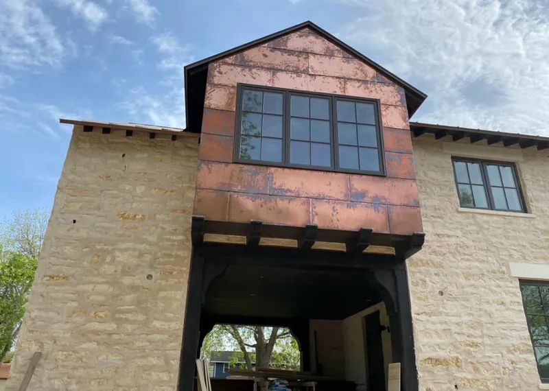 Copper metal panel facade on a stone building for Skylight Installation in Bartonville